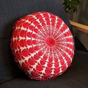 Decorative red and white throw pillow